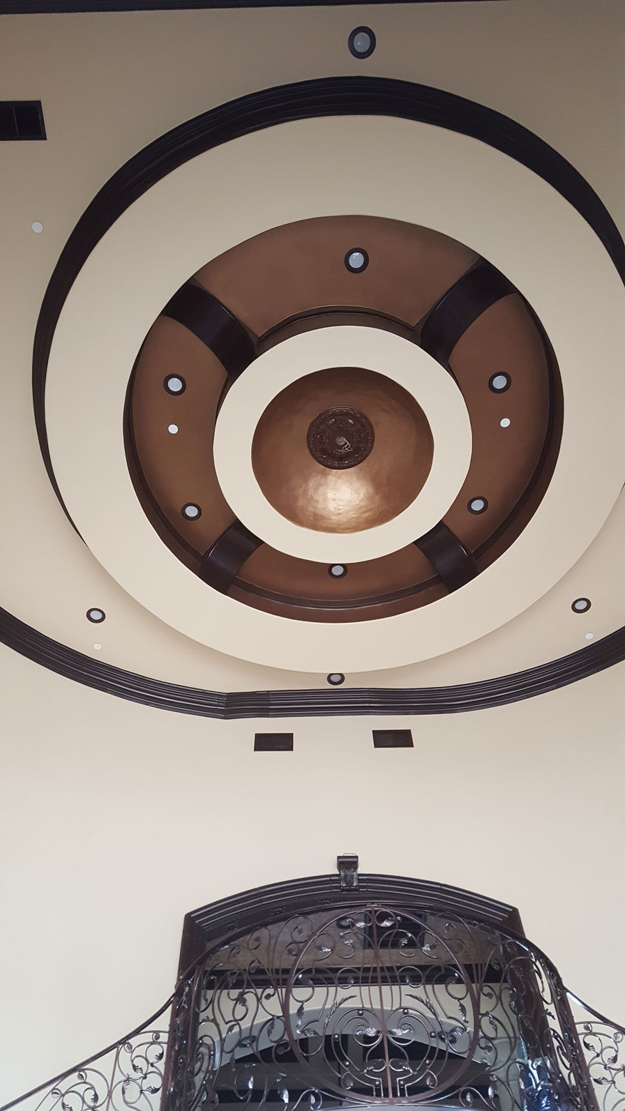 Rotunda ceiling with copper dome and iron railing